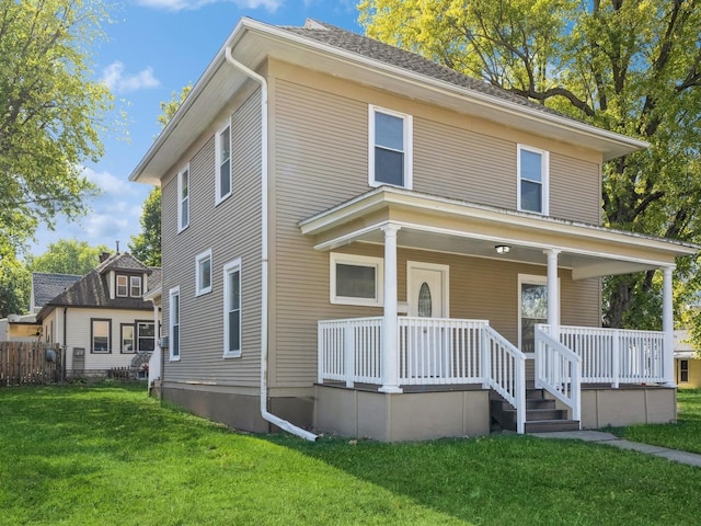 view of front of home featuring a porch and a front lawn