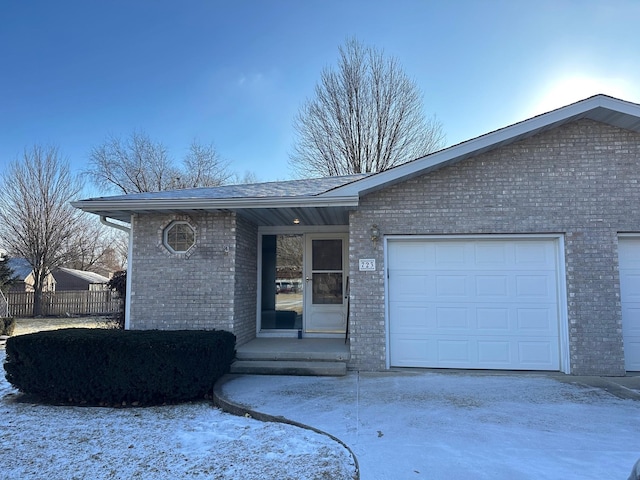 single story home featuring a garage