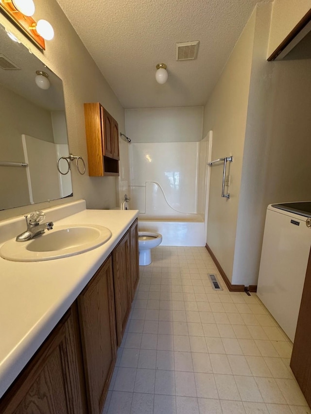 full bathroom featuring washer / clothes dryer, toilet, a textured ceiling, vanity, and shower / bathtub combination