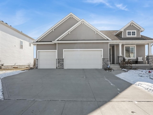 craftsman-style house featuring a garage and covered porch