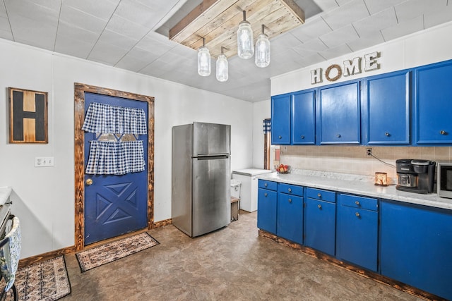 kitchen with blue cabinets, stainless steel refrigerator, and pendant lighting