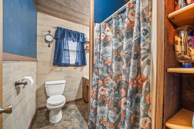 bathroom featuring toilet and walk in shower