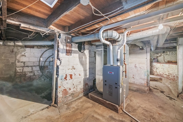 utility room featuring heating unit