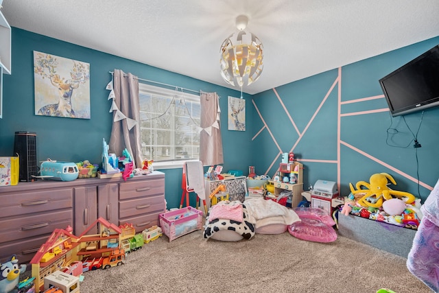 rec room with carpet and a textured ceiling