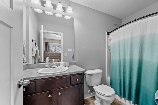 full bathroom featuring a textured ceiling, vanity, toilet, hardwood / wood-style flooring, and shower / bath combo