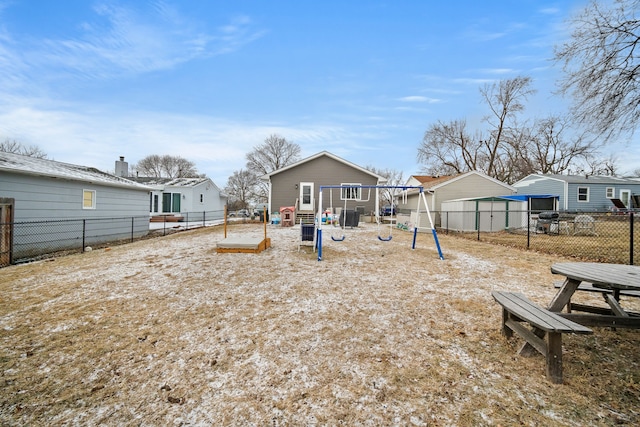 rear view of house with a playground