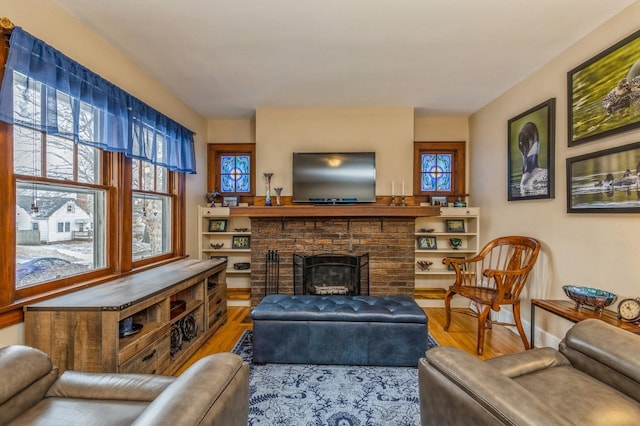 living room with hardwood / wood-style floors and a fireplace