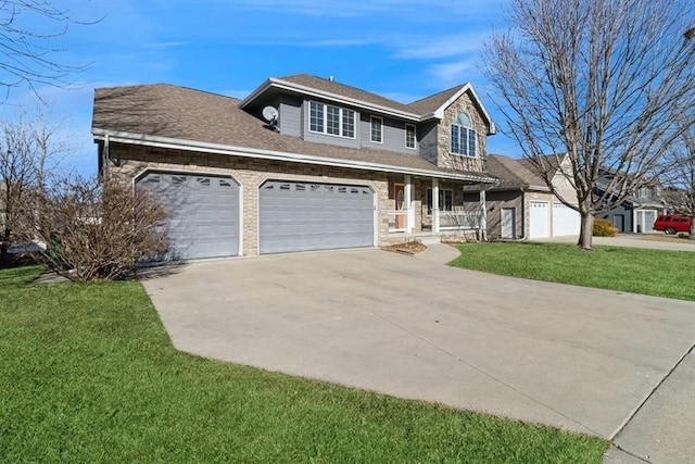 view of front facade with a garage, a front yard, and covered porch