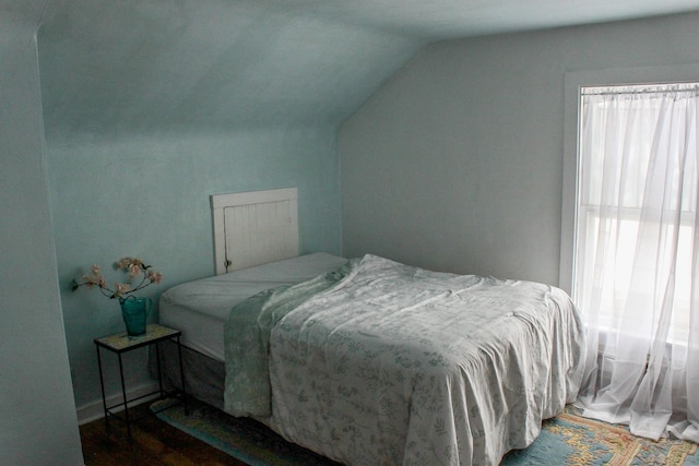 bedroom featuring lofted ceiling