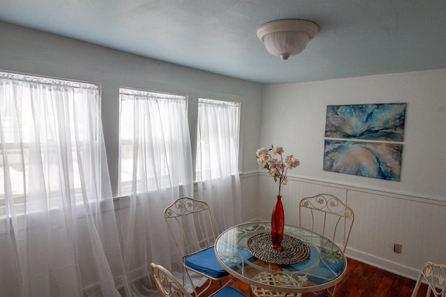 dining space with hardwood / wood-style flooring