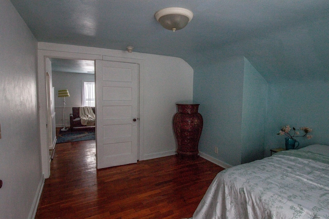 bedroom featuring dark hardwood / wood-style flooring