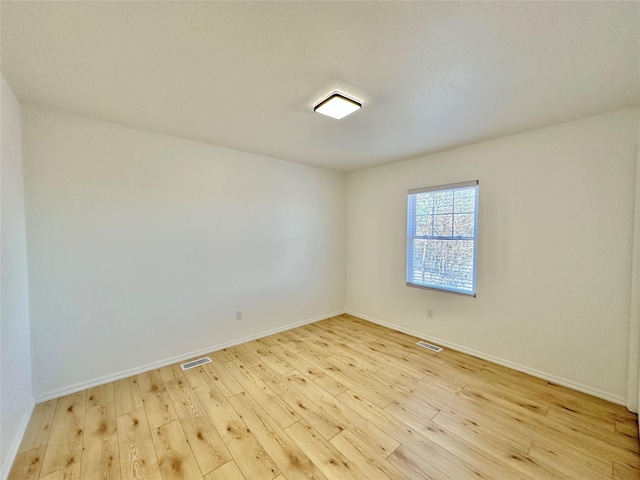 unfurnished room featuring light wood-type flooring