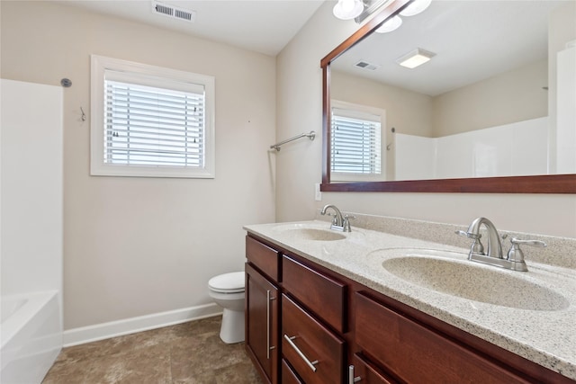 bathroom featuring a healthy amount of sunlight, a sink, and visible vents