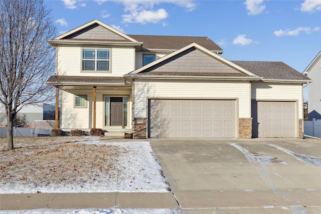 craftsman house with a garage, covered porch, concrete driveway, and fence