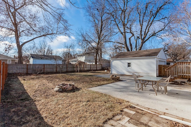 view of yard with an outbuilding and a patio