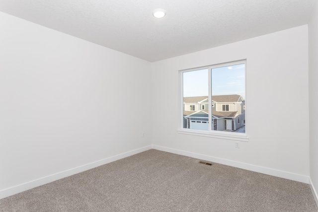 empty room featuring carpet floors