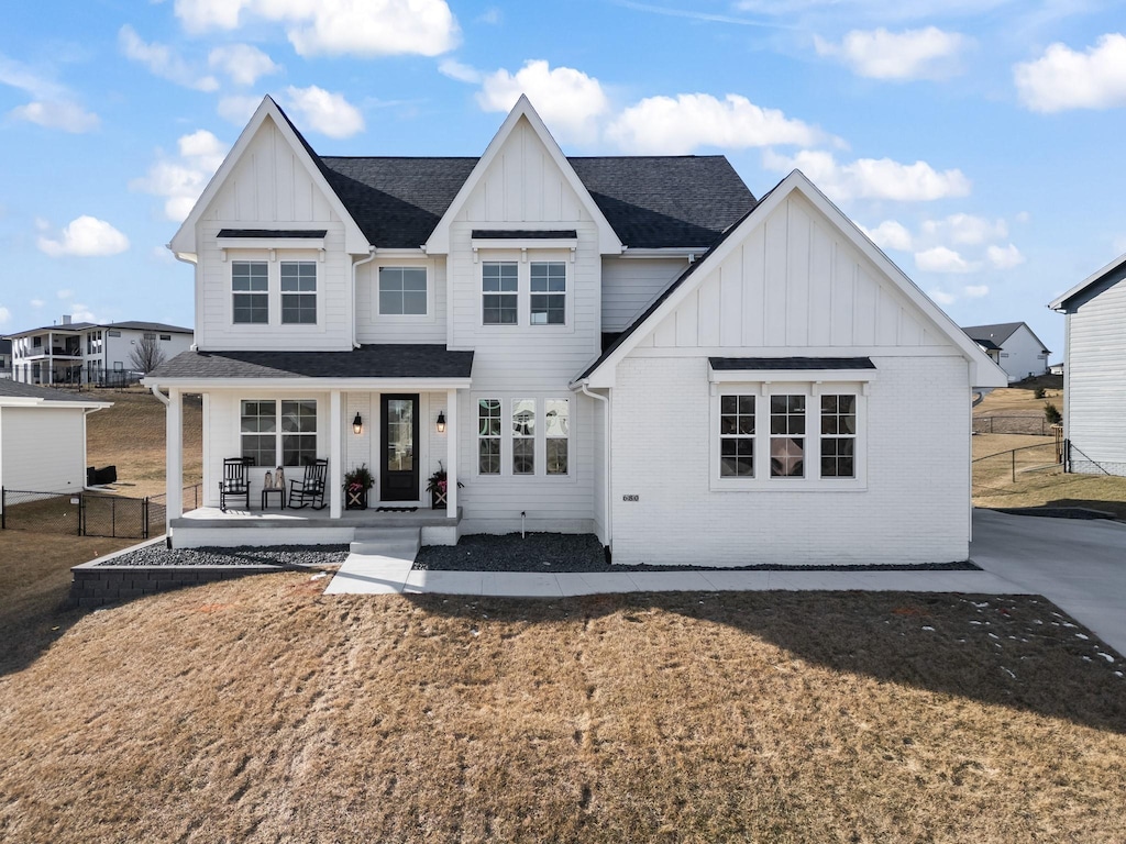 view of front of home featuring a front lawn and a porch