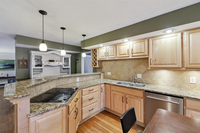 kitchen featuring a sink, dishwasher, and light brown cabinetry