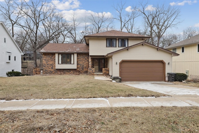 view of front facade with a garage and a front lawn