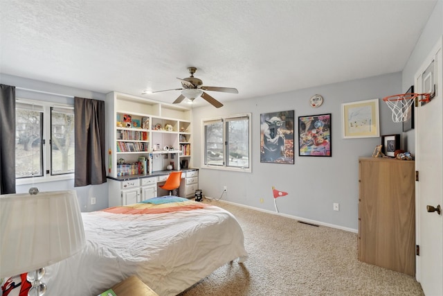 bedroom with visible vents, multiple windows, carpet flooring, and baseboards