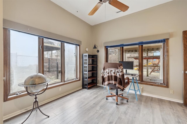 office area featuring a ceiling fan, baseboards, and wood finished floors