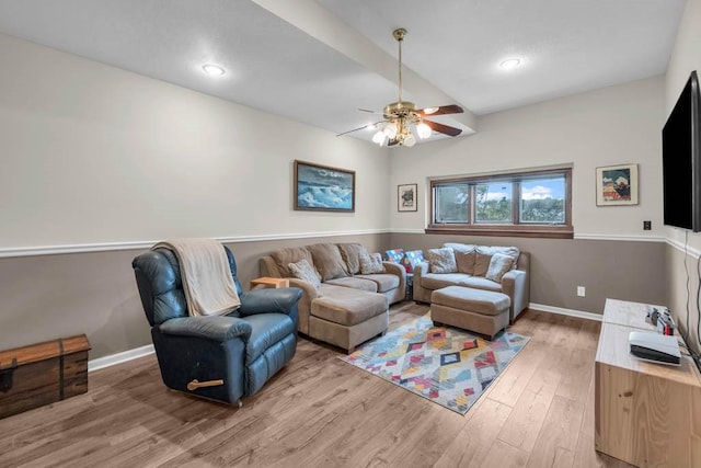 living room with recessed lighting, light wood-type flooring, a ceiling fan, and baseboards