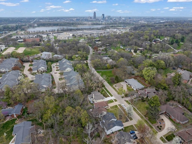 drone / aerial view with a residential view and a water view