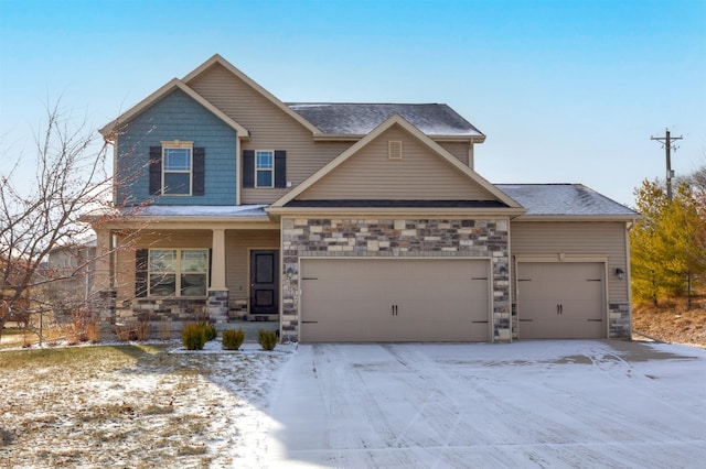 craftsman-style home with an attached garage, a porch, and stone siding