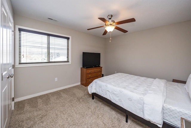 bedroom with baseboards, visible vents, ceiling fan, and carpet flooring