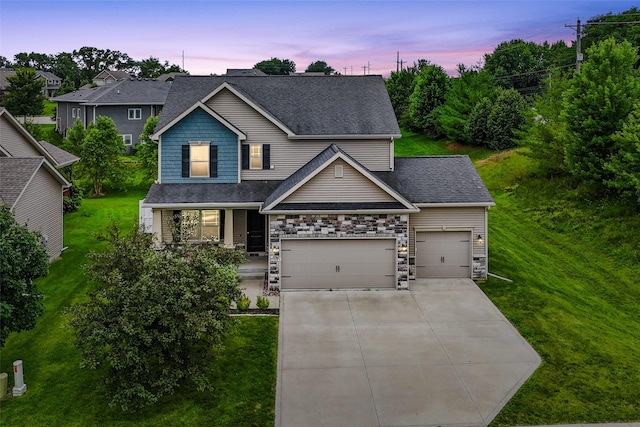 16924 Prairie Dr, Clive, IA 50325 - view of front facade featuring a front lawn, an attached garage, driveway, a shingled roof, and covered porch