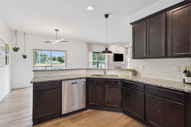 16924 Prairie Dr, Clive, IA 50325 - kitchen with stainless steel dishwasher, backsplash, light wood-type flooring, dark brown cabinets, and recessed lighting