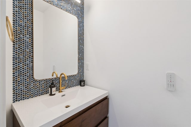 16924 Prairie Dr, Clive, IA 50325 - bathroom featuring decorative backsplash and vanity