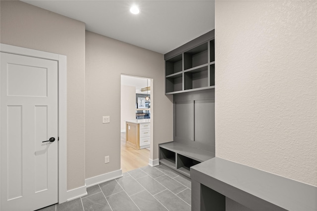 mudroom with tile patterned floors