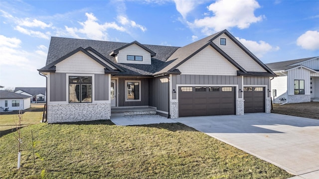 view of front of house featuring a garage and a front yard