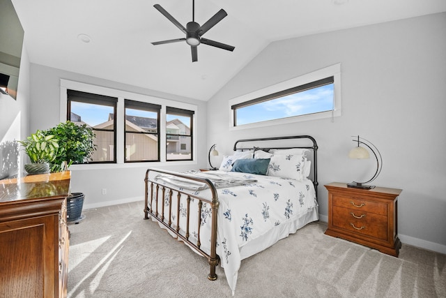 bedroom featuring vaulted ceiling, carpet, baseboards, and ceiling fan