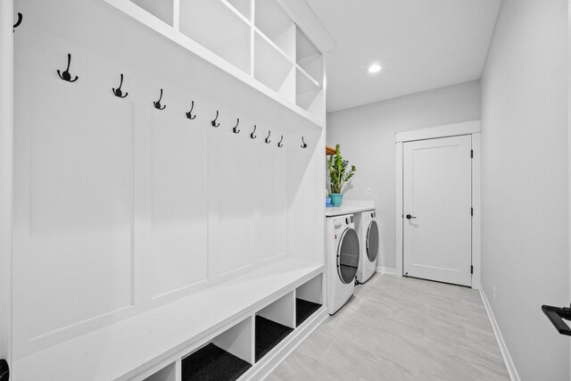 mudroom with washing machine and clothes dryer