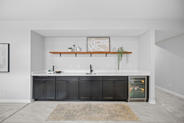 bar with sink and wine cooler