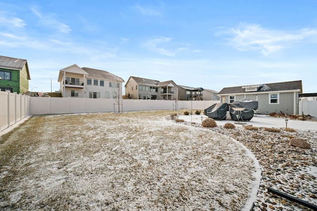 view of yard with a residential view and a fenced backyard