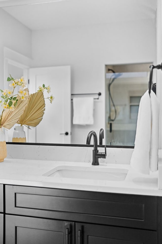 bathroom featuring vanity and walk in shower