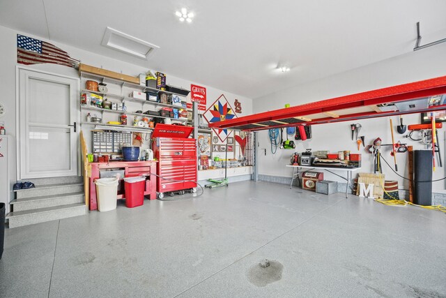 garage with a workshop area