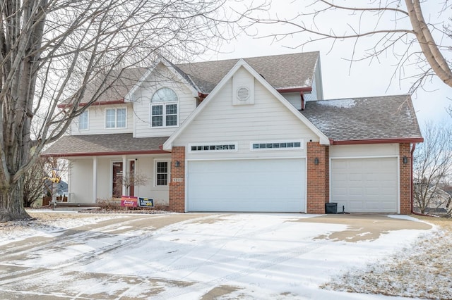 view of front facade with brick siding, covered porch, an attached garage, and a shingled roof