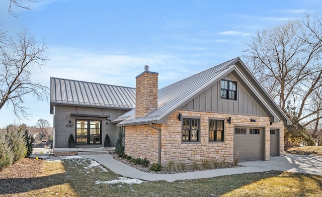 modern inspired farmhouse with a garage