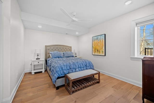 bedroom with ceiling fan and light hardwood / wood-style flooring