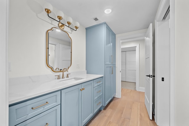 bathroom featuring vanity and hardwood / wood-style floors