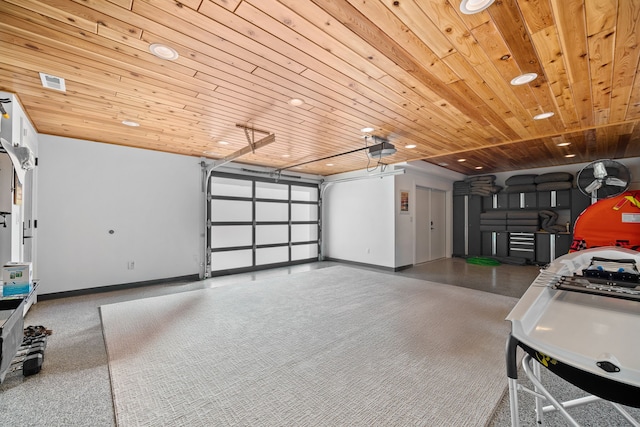 garage featuring a garage door opener and wooden ceiling