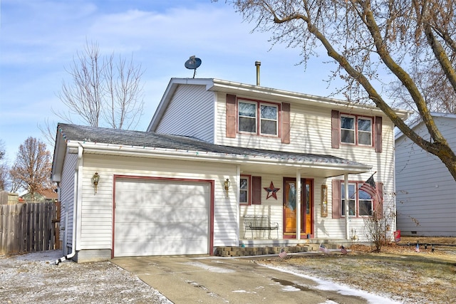 view of property featuring a garage and covered porch