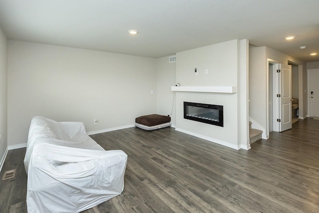 living area with dark hardwood / wood-style flooring