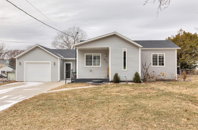 ranch-style home featuring a garage and a front lawn