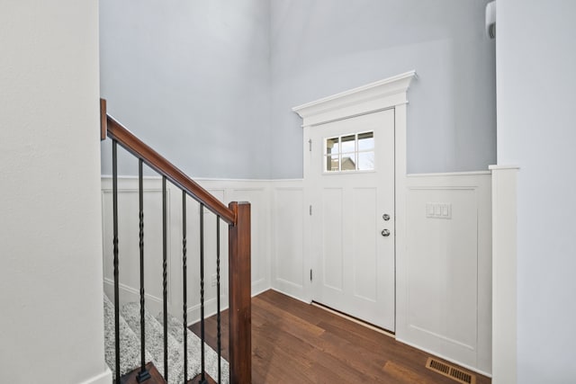 foyer entrance with dark hardwood / wood-style flooring