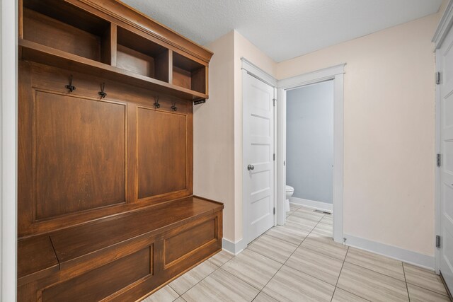 mudroom with light tile patterned floors